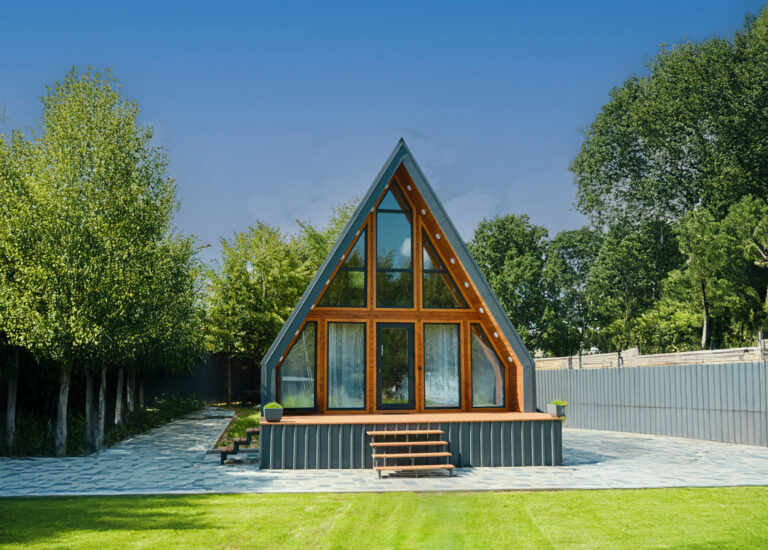 Mother and daughter sitting on a folding chairs on the terrace of a tiny house